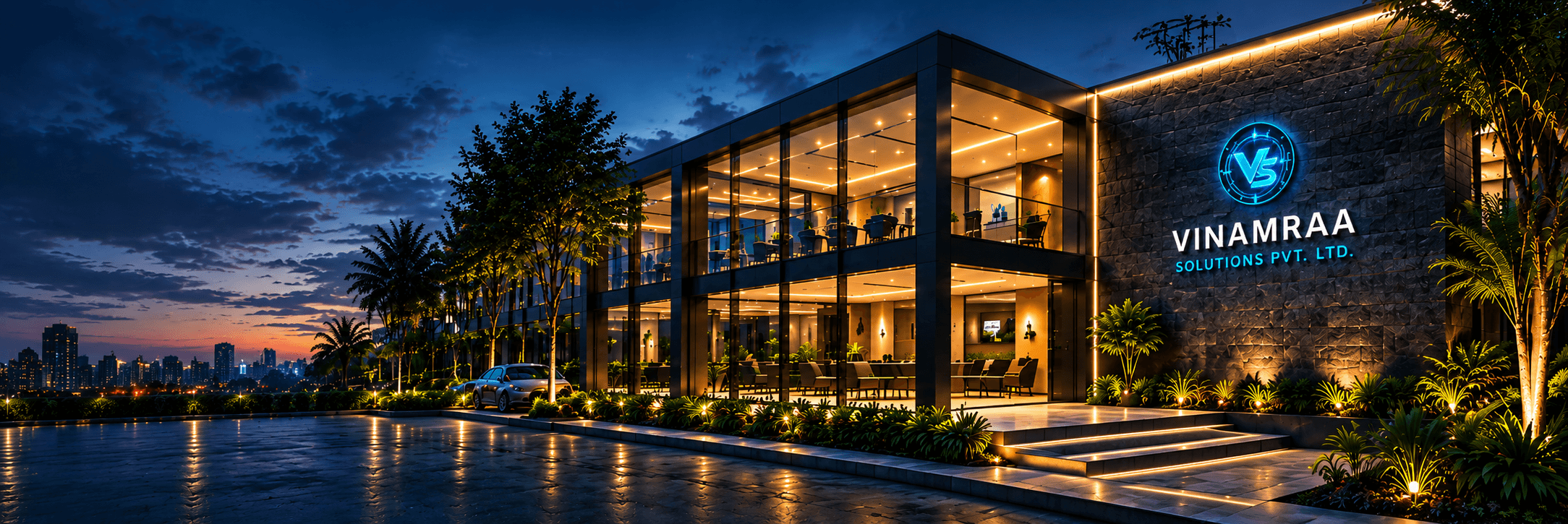 Vinamraa Solutions Corporate Headquarters building illuminated at night with VS emblem